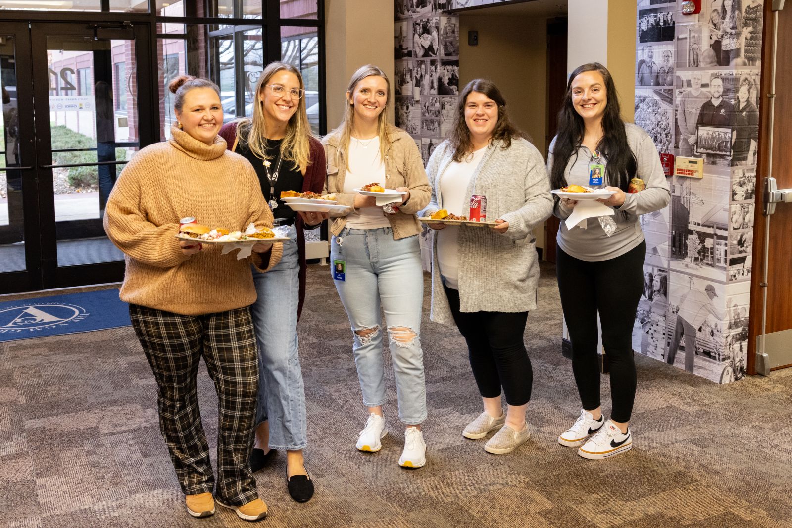 Image of three VGM Employee Owners smiling at table together