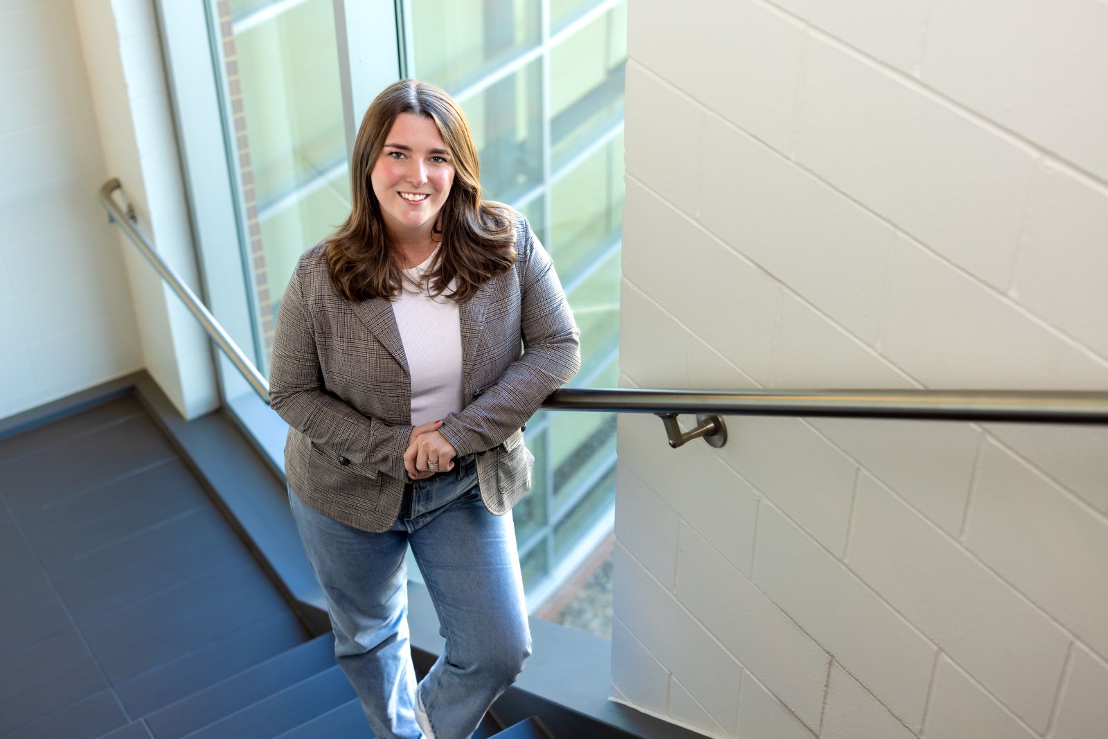 Hadie Dobson smiling standing in building